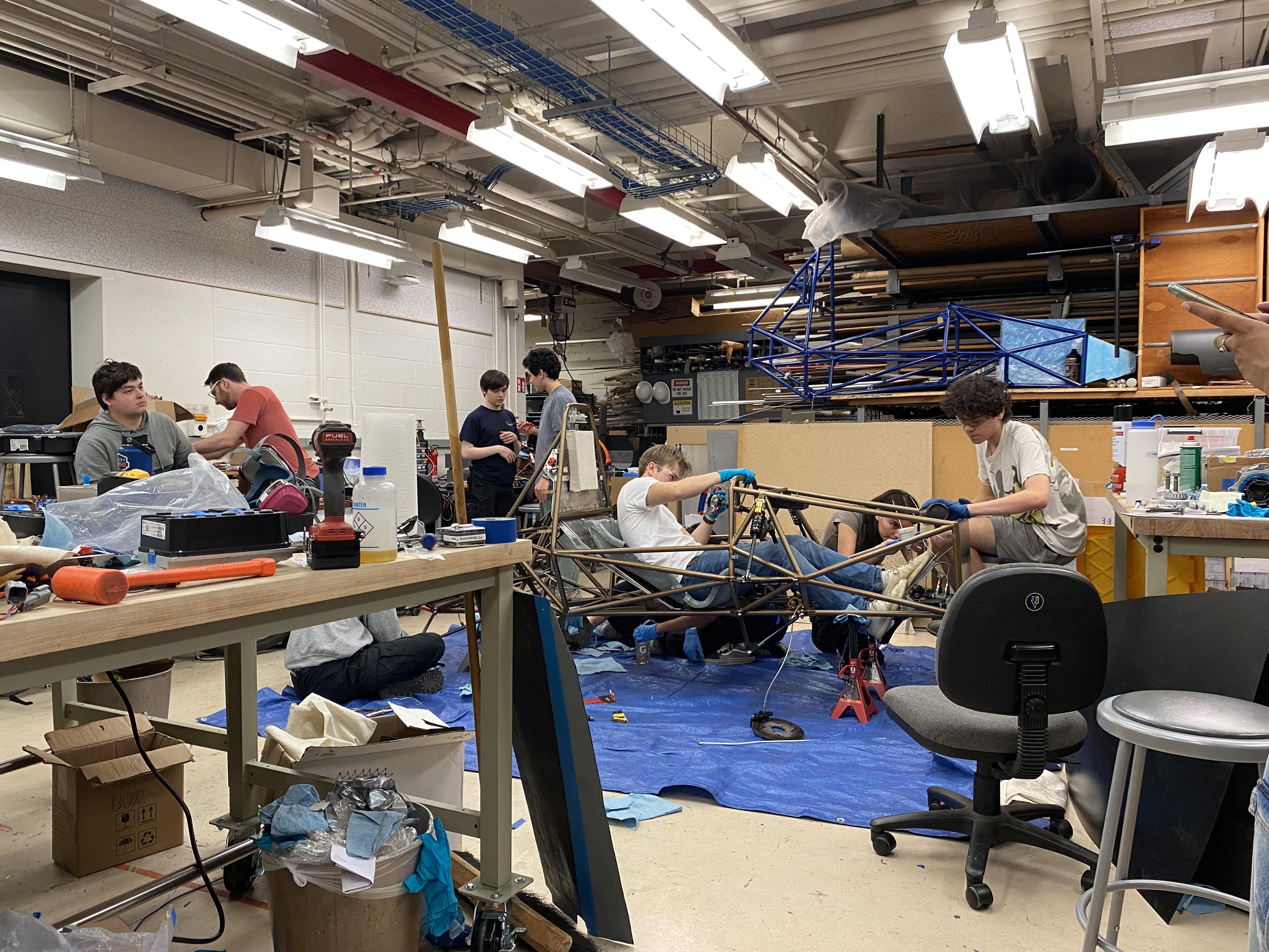 Team Members Work Together to Help Get the Car Ready For Competition